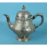 A Victorian silver teapot of baluster form embossed and engraved, with inscription, maker Millidge &