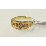 An 18ct gold gypsy ring set two rubies, diamond points and seed pearls, size O, 2.3g.