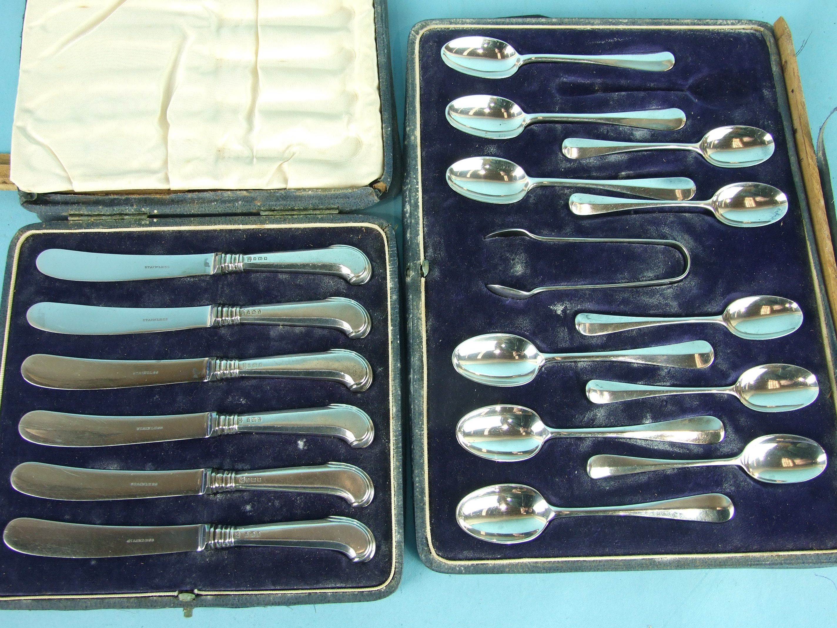A case of eleven silver rat tail teaspoons and sugar tongs, London 1911 and a cased set of six