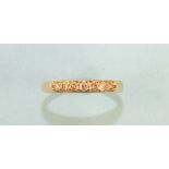 A 9ct gold half-hoop ring set seven brilliant-cut diamonds, size R, 1.6g.