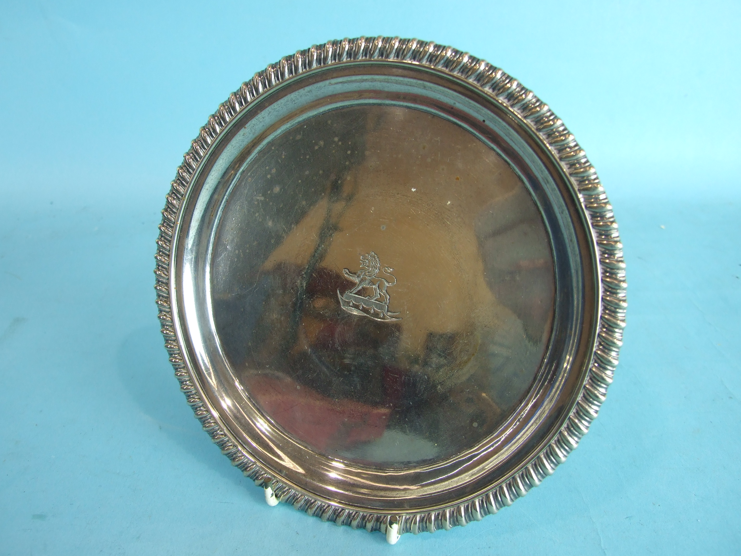 A small George III silver salver with gadrooned rim and raised on three cast feet, 17.7cm - Image 2 of 3