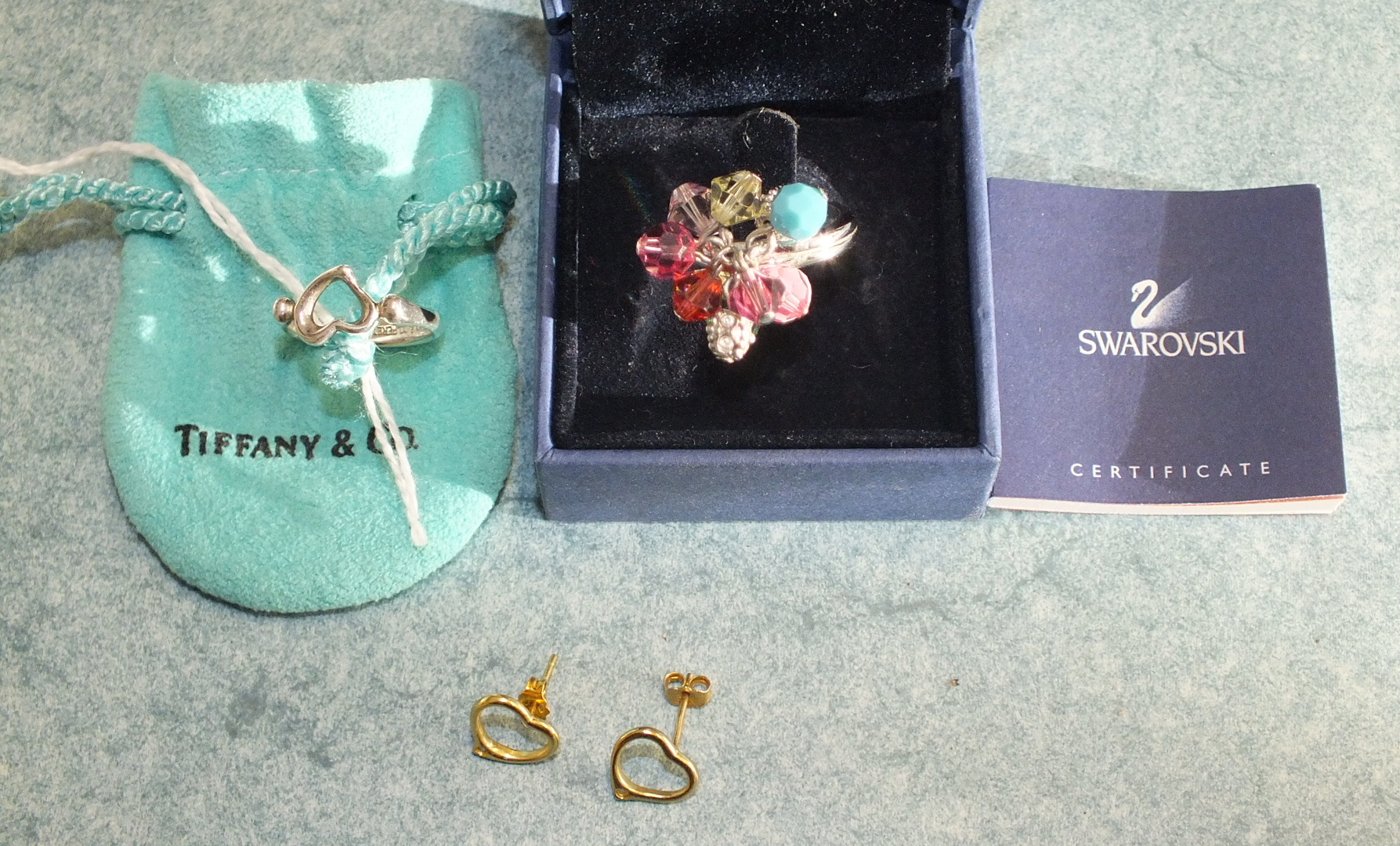 Tiffany & Co, a silver heart ring signed Peretti, size I, in bag, a pair of similar earrings and a