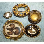 A large Victorian gilt metal swivel brooch (af), another set agates (central setting vacant), and