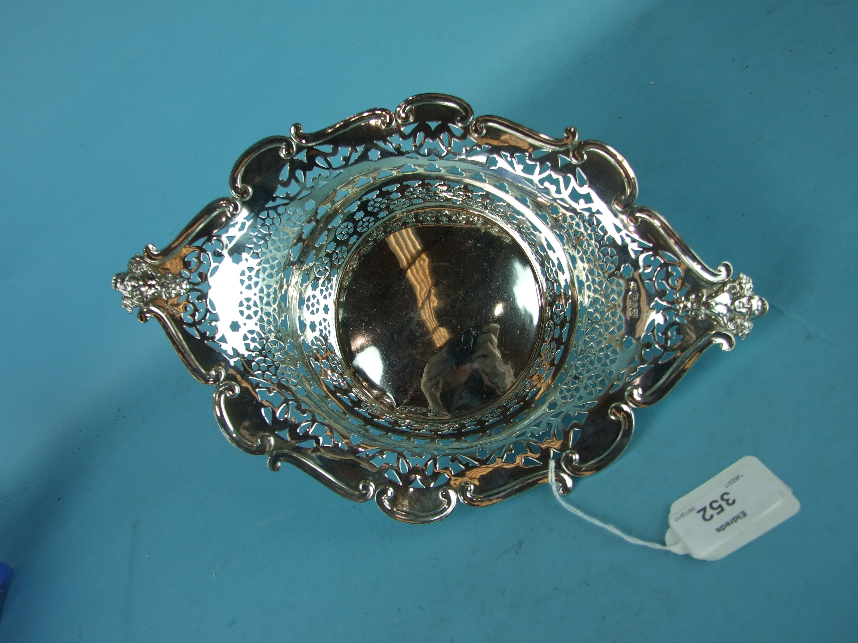 An Edwardian pierced silver basket of lozenge shape raised on pierced scroll feet, 30 x 22cm, - Image 2 of 2