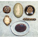 A Victorian onyx locket back brooch with seed pearl monogram, a Ruskin-style brooch and other