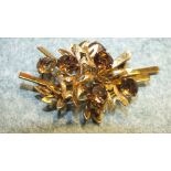 A 14k yellow gold spray brooch claw set six Cairngorms amidst textured and smooth foliage, 6.5cm,