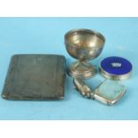 An engine turned silver cigarette case, Birmingham 1913, a small golf trophy, Birmingham 19929, a