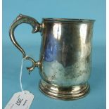 A Victorian baluster-shaped plain tankard with leaf-capped scroll handle, 13cm high, London 1865,