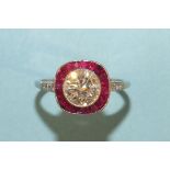 A diamond and ruby cluster ring millegrain-set a brilliant-cut diamond of approximately 1.5cts