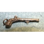 A novelty pencil in the form of a flintlock pistol, marked 'Reserve', 4.5 cm (af).