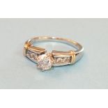A solitaire diamond ring claw set a brilliant cut diamond of approximately 0.3cts between