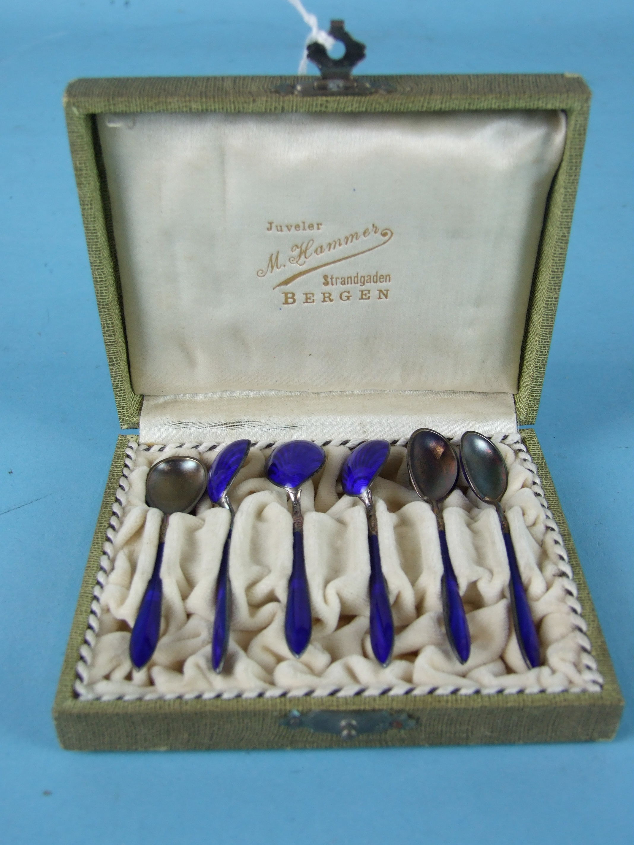 A set of six Scandinavian blue enamelled salt spoons in fitted case, marked M Hammes, Bergen.