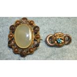A Victorian brooch of three linked rings with turquoise set bunch of grapes overlay, 3.5cm, 5.6g and
