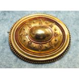A Victorian 18ct gold oval brooch with cannetile decoration, 7.9g.