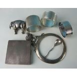 An engine turned silver compact, (no mirror), three silver napkin rings and other items, weighable