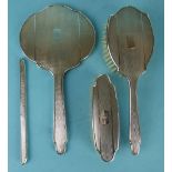 A four-piece silver-backed dressing table set with wavy engine turning, Birmingham 1957, (comb