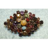 A multi-gem brooch, possibly Indian set forty-three mainly faceted stones including amethyst,