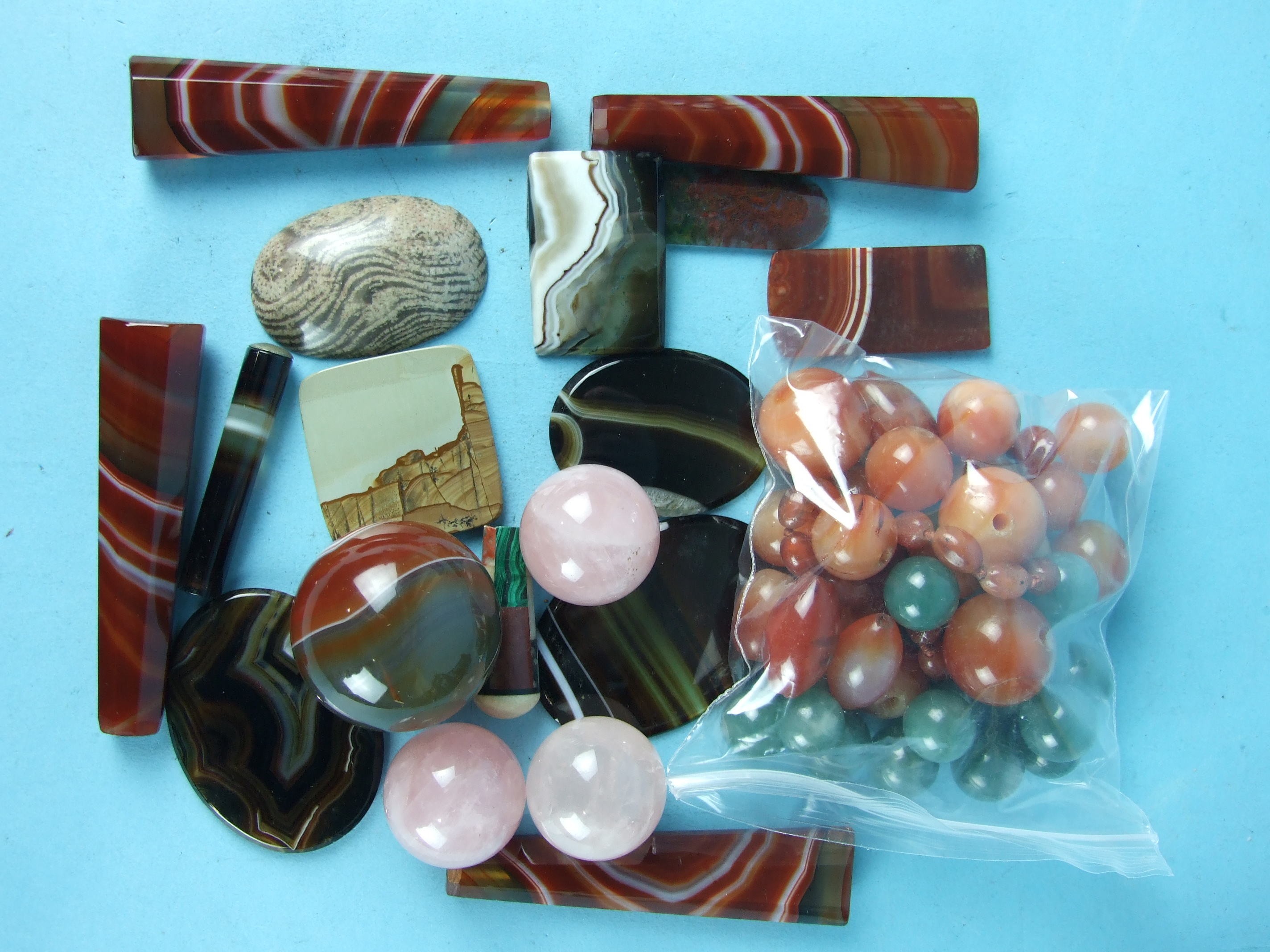 A large agate ball, 4cm diameter, three rose quartz balls, 3cm, various hardstone beads, seven