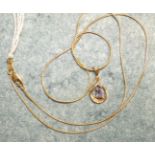 A small gold tear drop pendant set amethyst and diamond point on 14k gold chain, 46cm, 3.4g.