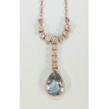 An aquamarine and diamond necklace millegrain-set a pendeloque-cut aquamarine of approximately 1.