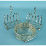 A pair of four division toast racks on ball feet, marks rubbed, and a circular pierced silver butter