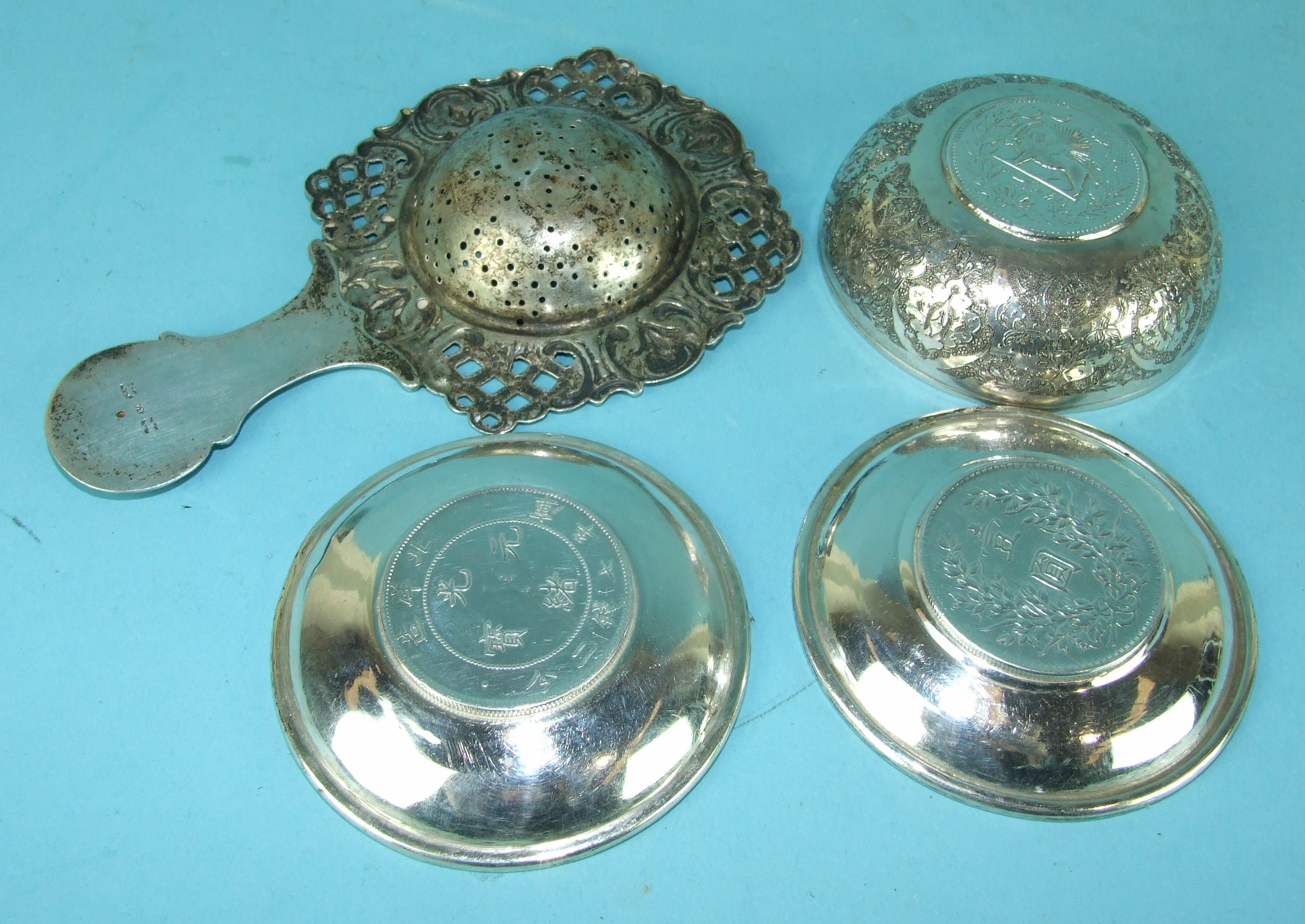 A Continental white metal tea strainer with pierced foliate border and handle, 14cm long and three - Image 2 of 2