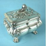 A Continental silver tea caddy of lobed squat form, the lid with pomegranate finial, (hinge damaged)