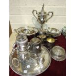 A silver-plated oval breakfast dish raised on paw feet, 34cm diameter, a plated circular tray and