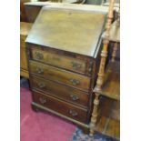 A late-19th/early-20th century bureau, the rectangular top with fall front above four drawers, on