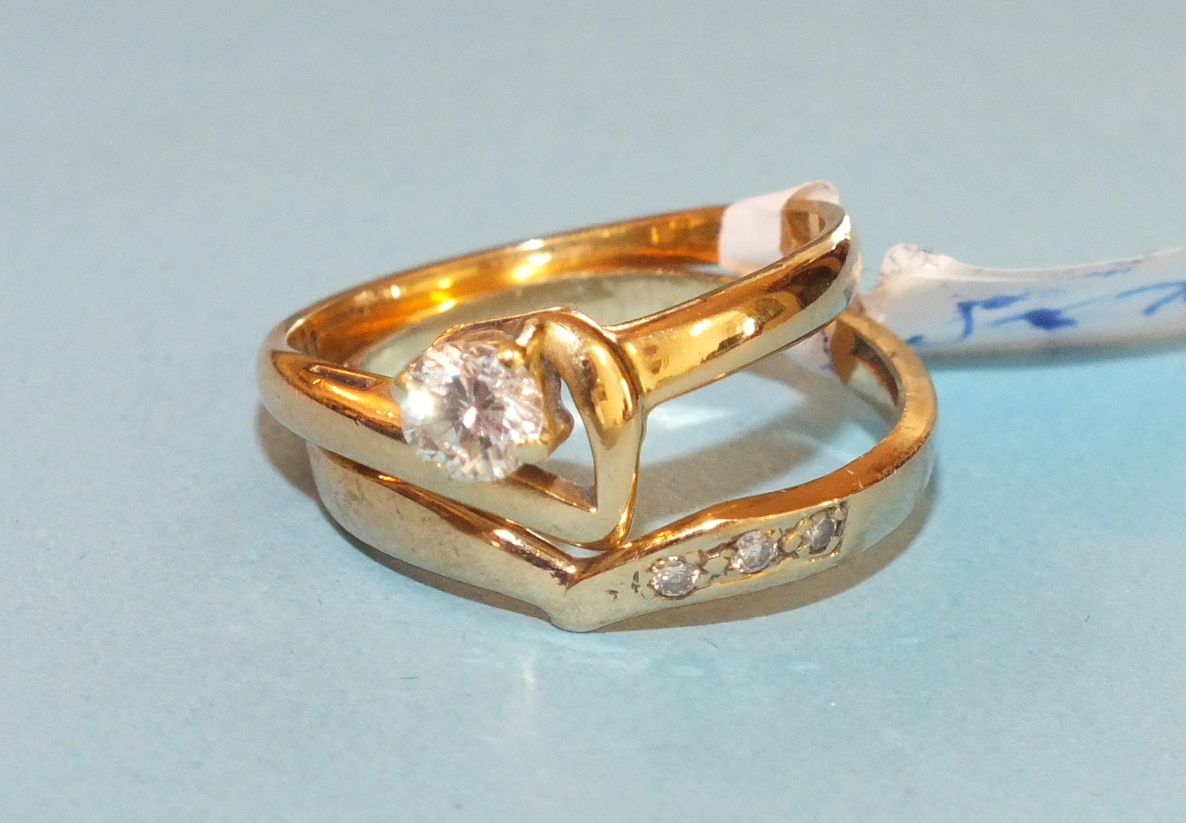 A solitaire diamond ring, claw set a brilliant cut diamond of approximately 0.4cts in 18ct yellow
