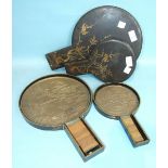 A large Japanese bronze mirror decorated with a crane, 39cm long in a fitted and decorated lacquer