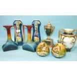 A pair of Continental ceramic Art Nouveau-style vases painted with a woodland design, 27cm high, (