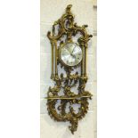 A gilt wood rococo style wall clock frame of heavy foliate design in the Chippendale taste,