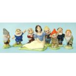 A set of Wade Snow White and the Seven Dwarves, (1 a/f), three other ceramic figures and a plastic