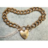 A 9ct gold curb link bracelet with padlock clasp, 36.8g.
