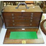 An American oak portable tool chest, the 'L S Starrett Company, Athol, Mass, USA', the box with