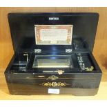A 19th century Swiss musical box, the 11cm comb and barrel playing six airs, with original list of