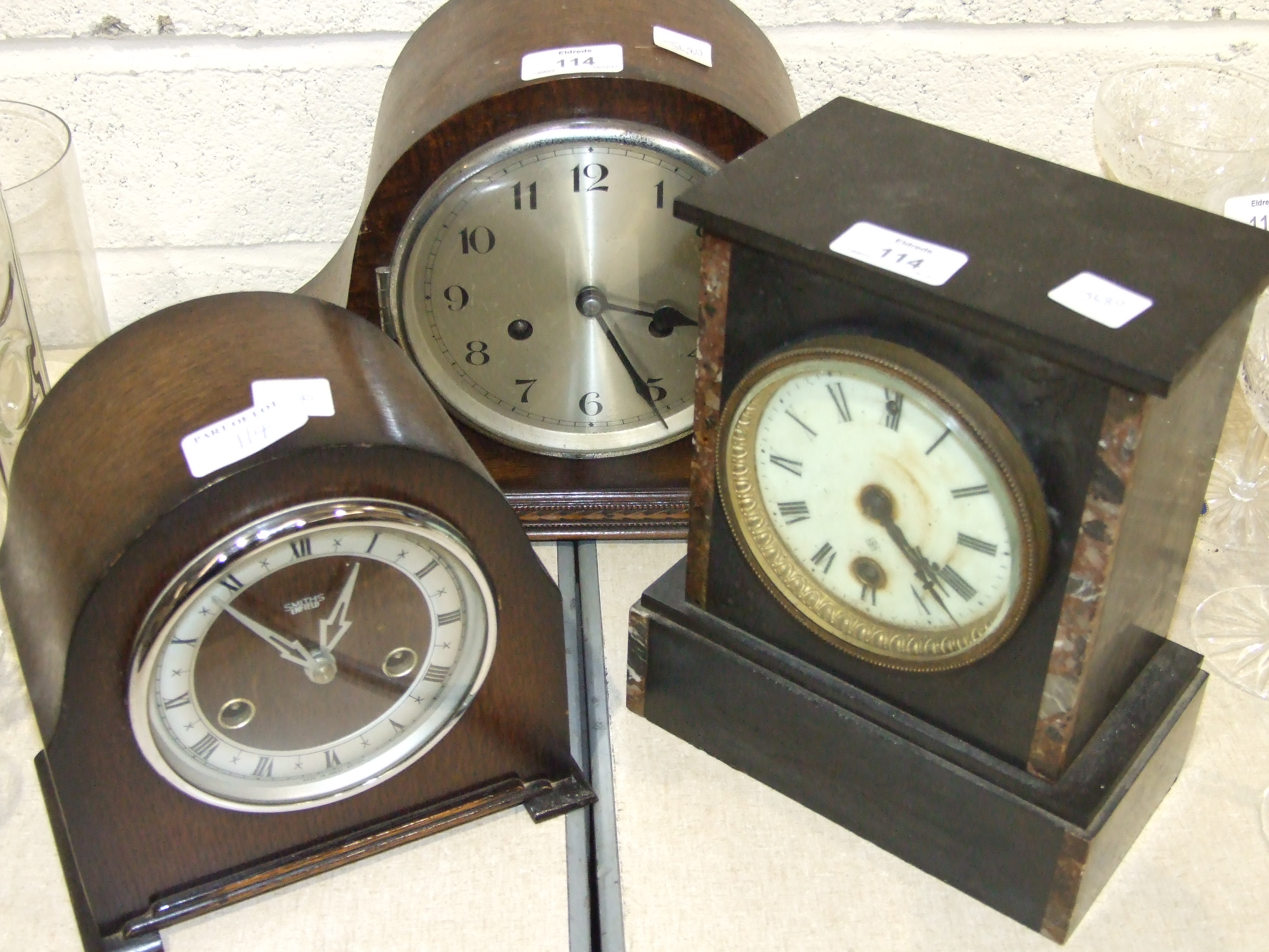 Two oak-cased striking mantel clocks and an Ansonia slate mantel clock, (3).