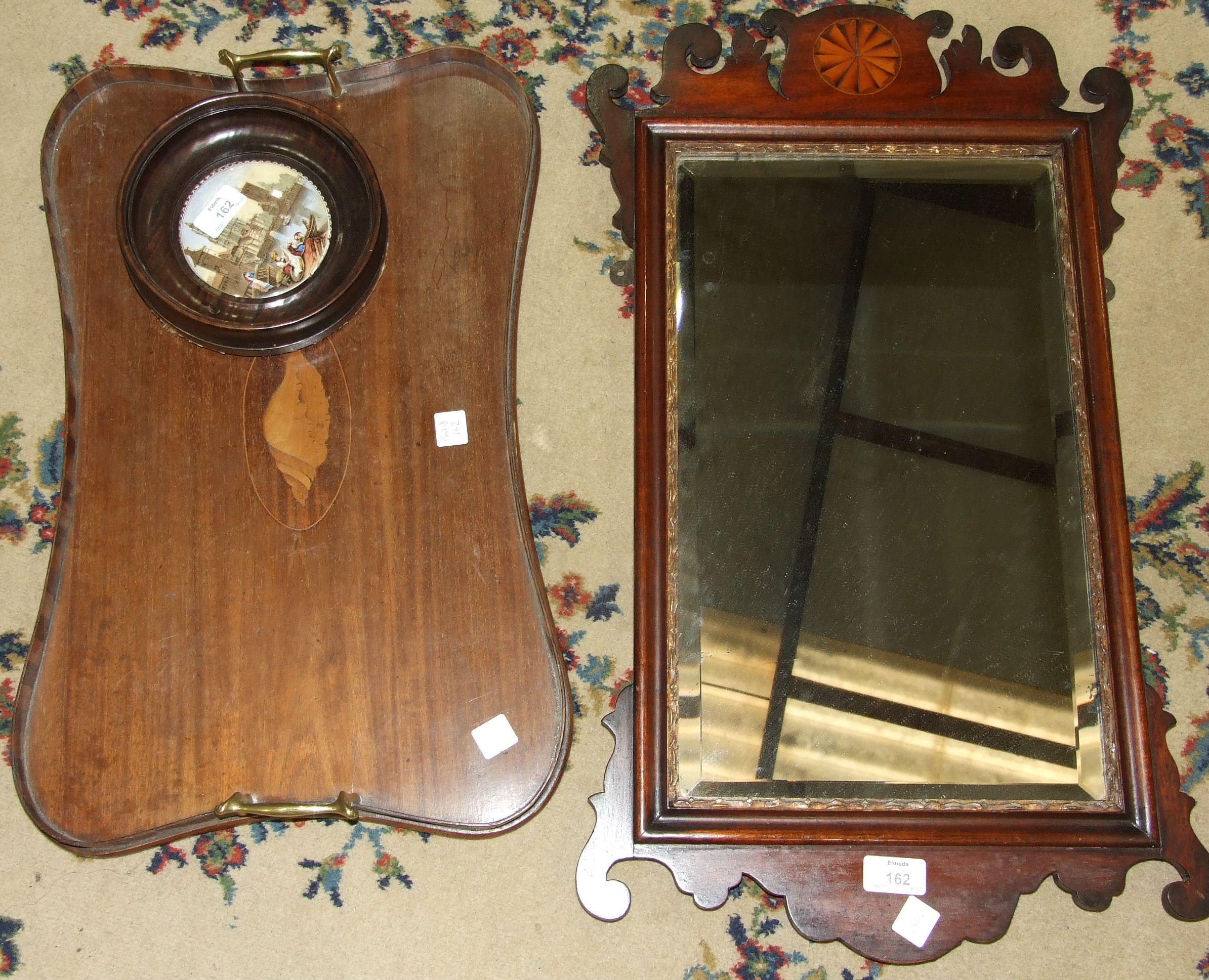 A Georgian-style mahogany and parcel gilt wall mirror, 40 x 70cm, an Edwardian two-handled concave-