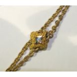 A 9ct gold guard chain with cannetile-decorated slider set two opals, 62cm long, 11g.