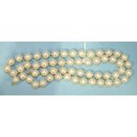 A string of fifty-seven uniform cultured pearls, 8mm diameter approximately, 56cm long, (no