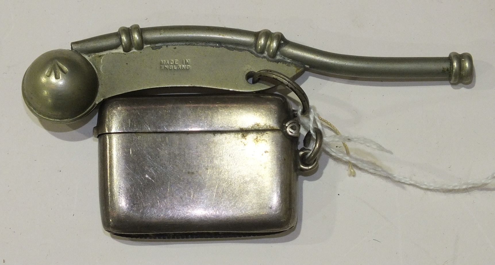 A silver Vesta case, Birmingham 1919 and a plated bosun's whistle, (2).