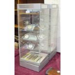 Two Perspex counter display units with electric revolving mechanism, together with a collection of