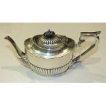 A silver oval half-gadrooned teapot, Birmingham 1890, ___12.5oz