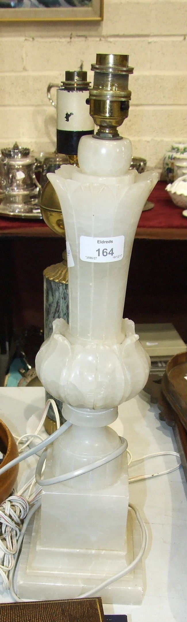 An alabaster table lamp, 50cm high and other items.