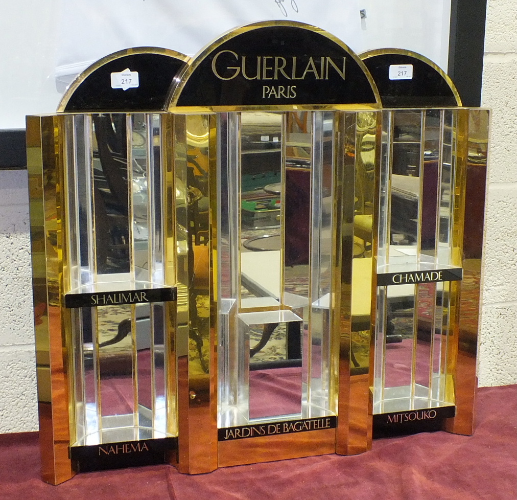 A mirrored perfume advertising display stand for Guerlain, Paris, 67cm high, 72cm wide.