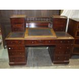 A 19th century mahogany estate desk, the top fitted with central hinged writing slope and fitted