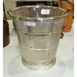 A modern cut-glass ice bucket of slightly-flared shape, with silvered metal mounts, 21cm high.