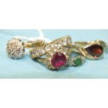 A small emerald and diamond-set 9ct gold ring, size J, a garnet set 9ct gold ring, size N and