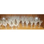 A collection of Stuart crystal and other etched Port glasses and liqueur glasses.